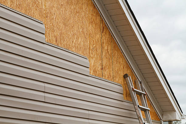 Professional Storm Damage Siding Repair technician working in Northfield, OH